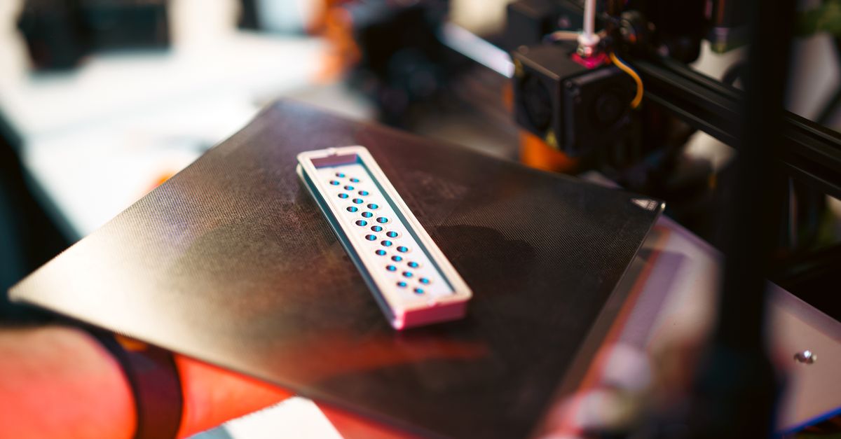 3D printing cost analysis spreadsheet with calculator and printed parts