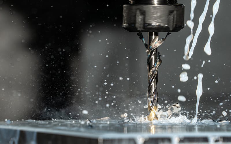 CNC milling machine creating precision tooling